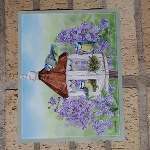 Bluebirds making a Nest in a Birdhouse surrounded by Purple Phlox Poster